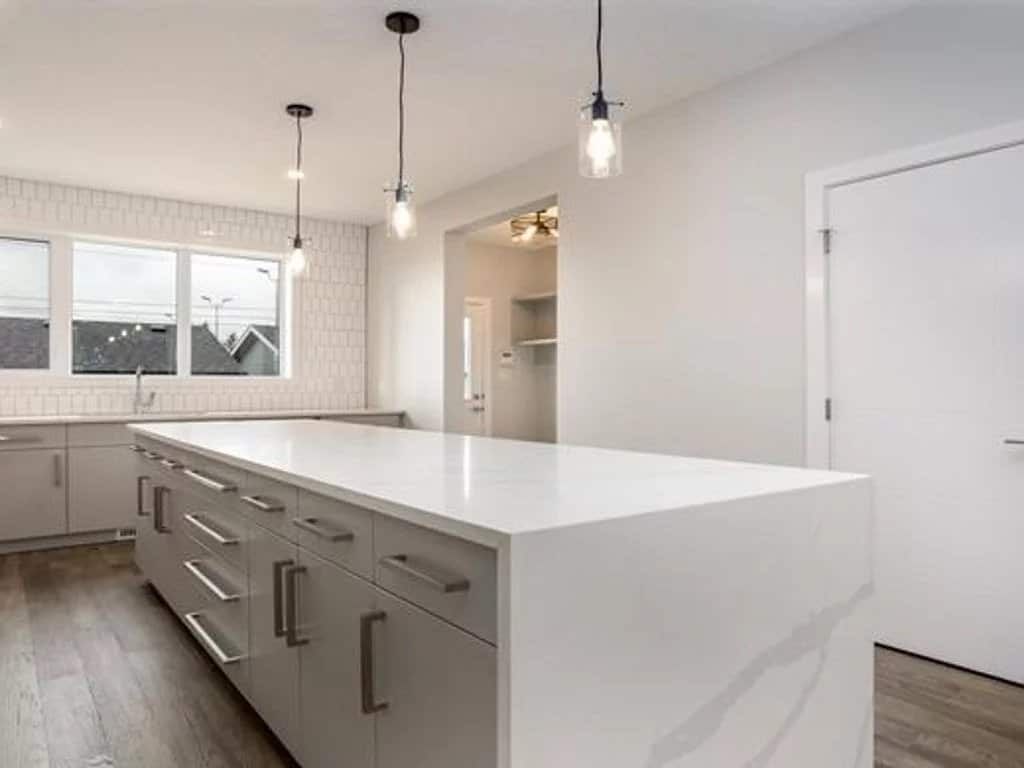 Modern kitchen in a luxury apartment with a large worktop in Bangkok, Thailand.