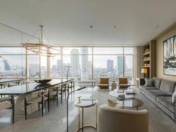 Interior of a luxury apartment in Bangkok with a view of the city.
