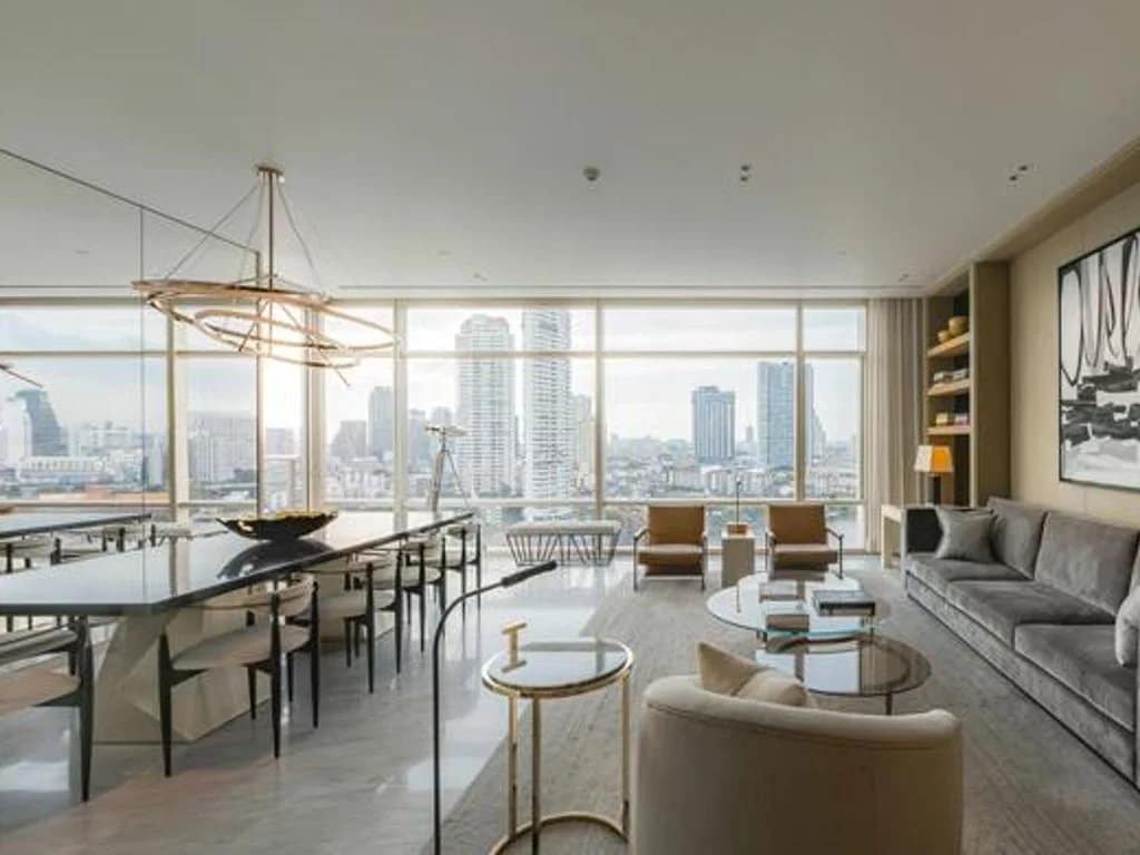 Interior of a luxury apartment in Bangkok with a view of the city.