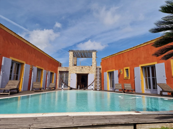 Property with swimming pool and patio, coloured walls, in Bonifacio, sea view.