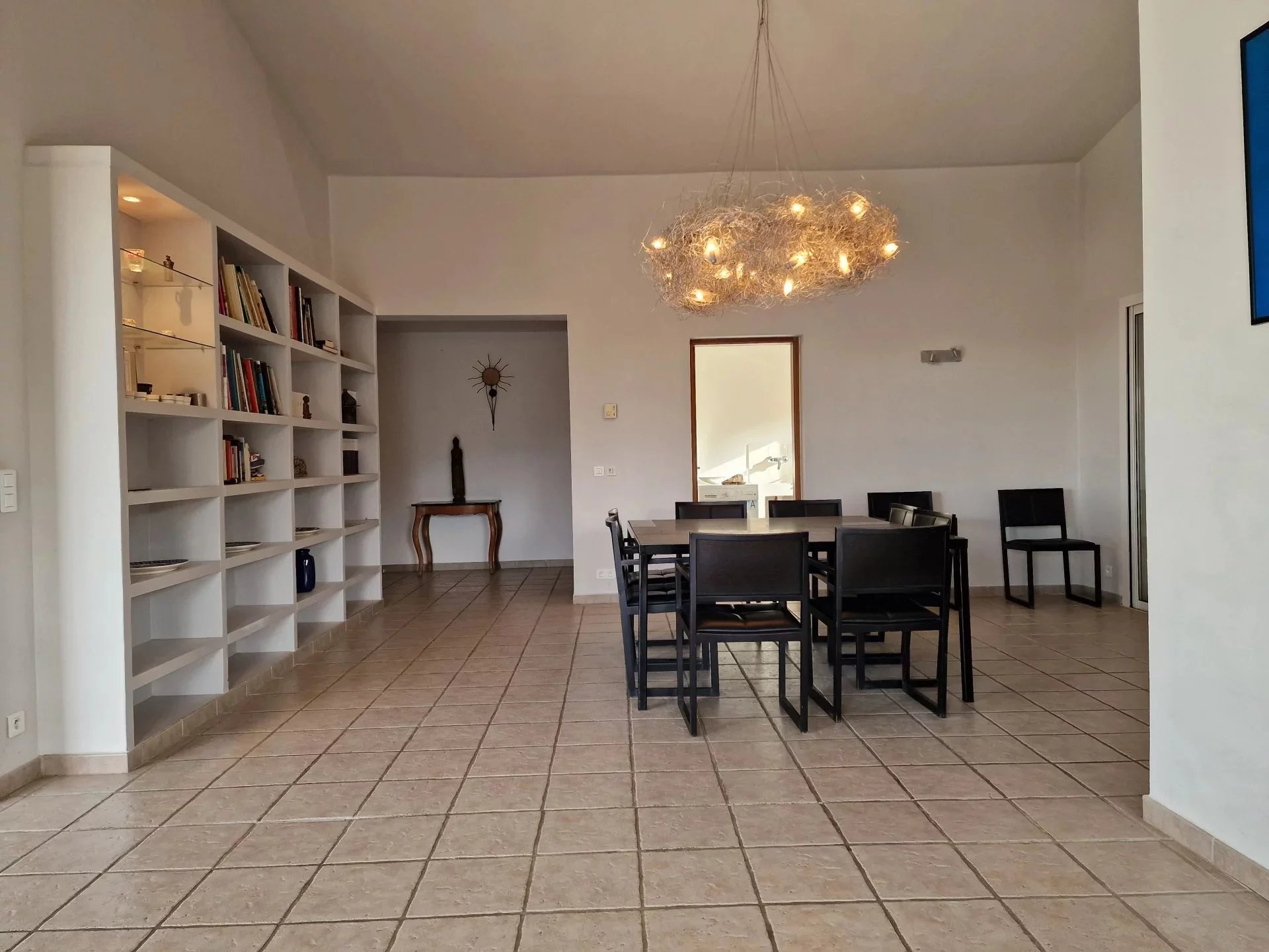 Interior of a property in Conca Interior of a property with dining room and library, sea view.