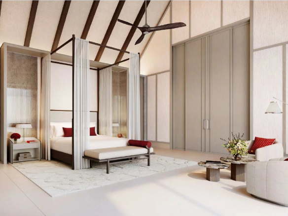Chambre d'une villa de luxe avec lit à baldaquin et décoration élégante aux Maldives.