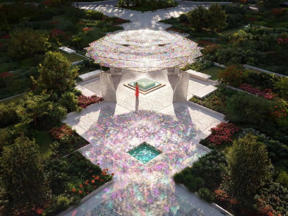 Vue aérienne d'un espace extérieur avec une structure moderne et des jardins fleuris.