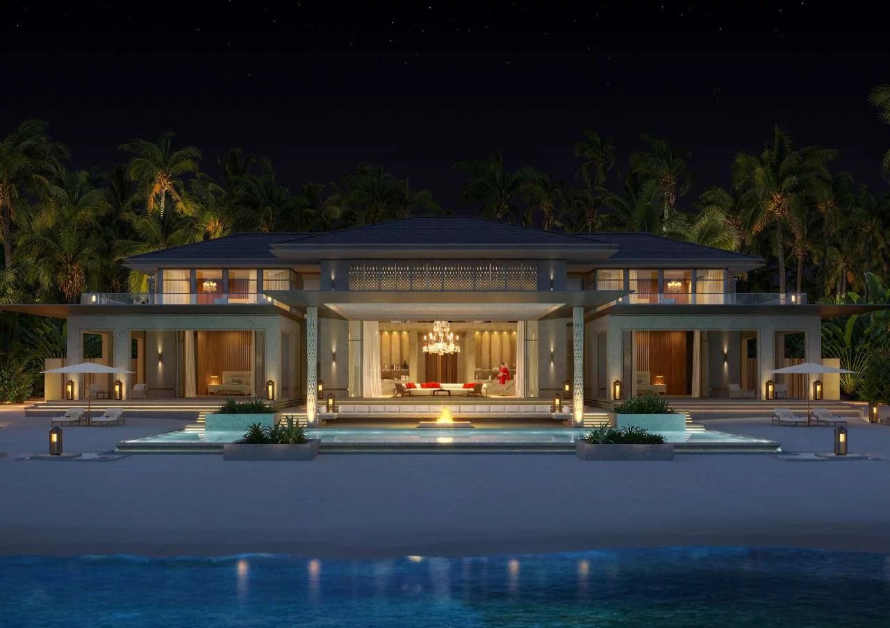 Villas de luxe au bord de la mer dans le South Malé Atoll, Maldives, illuminées la nuit.
