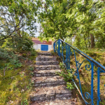 For sale house to be rearranged on large land with double garage