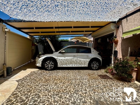 Car parked under a shelter in a house in La Londe-les-Maures.