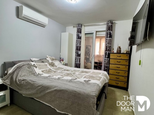 Room in a family home in La Londe-les-Maures with bed and furniture.