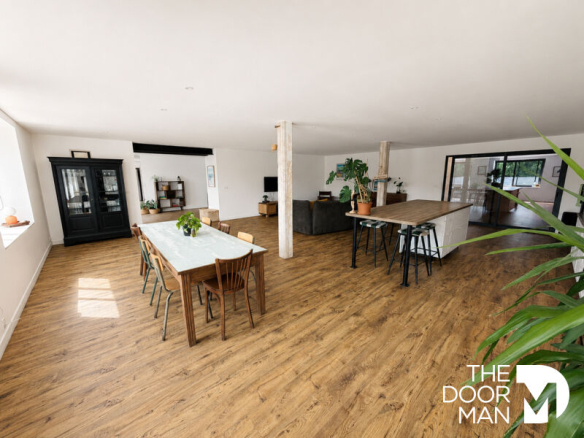 Interior of a spacious house with a large living area and an open kitchen.