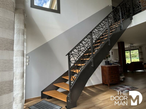 Modern wooden and metal staircase in a contemporary house.