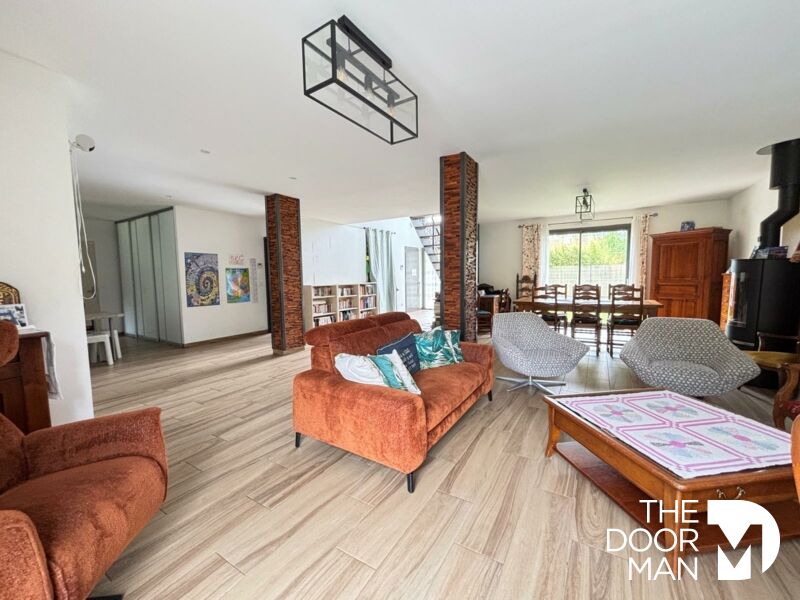 Modern interior of a house in Rambouillet Interior of a contemporary house in Rambouillet with a spacious living room and dining room.