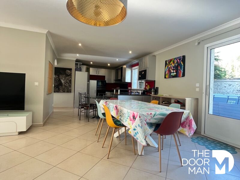 Interior of a house in Limours Interior of a modern house with dining room and open kitchen.