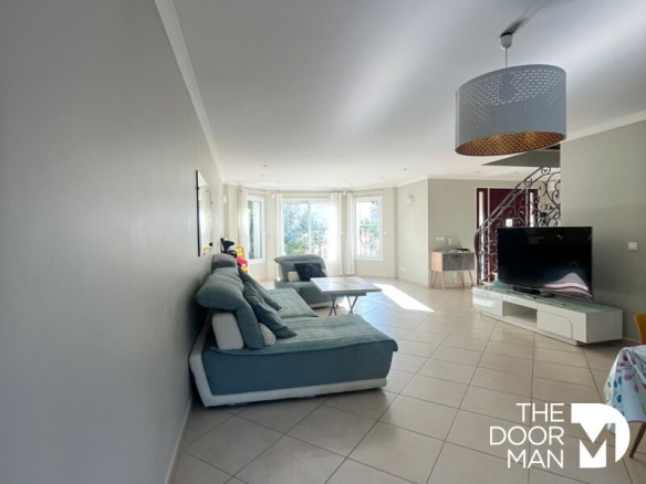 Interior of a modern house with a spacious and bright living room in Limours.