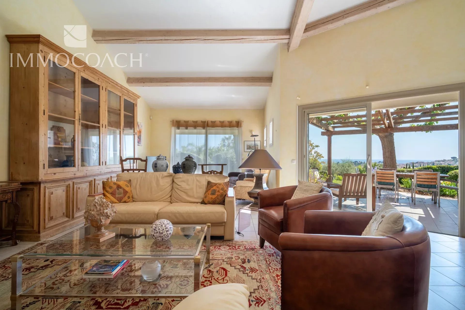 Villa in Carqueiranne with sea view Interior of a villa in Carqueiranne with sea view, bright living room and comfortable furniture.
