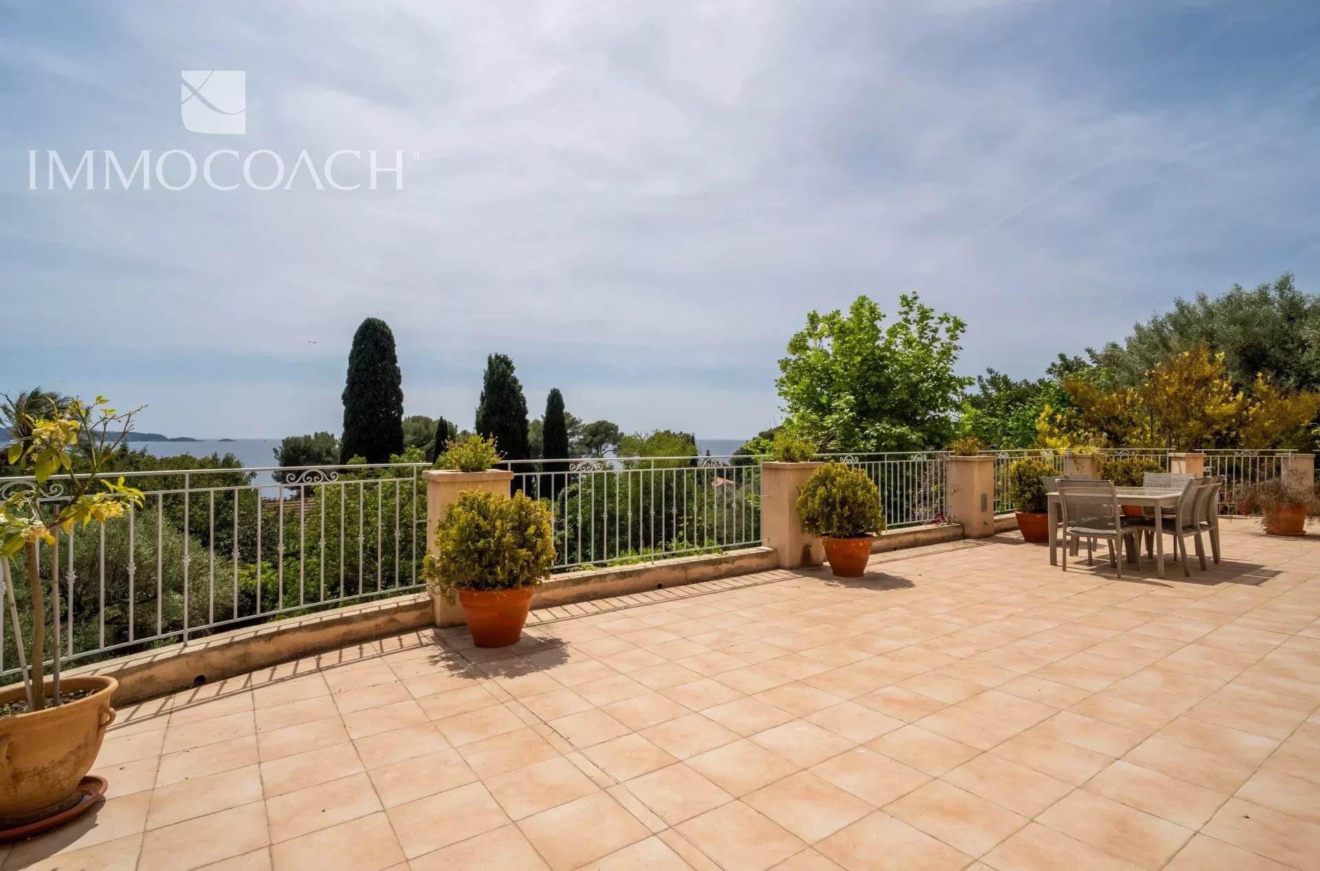 Spacious terrace with sea and garden views in Carqueiranne.