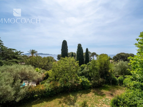 Sea view from a property surrounded by a landscaped park in Carqueiranne.
