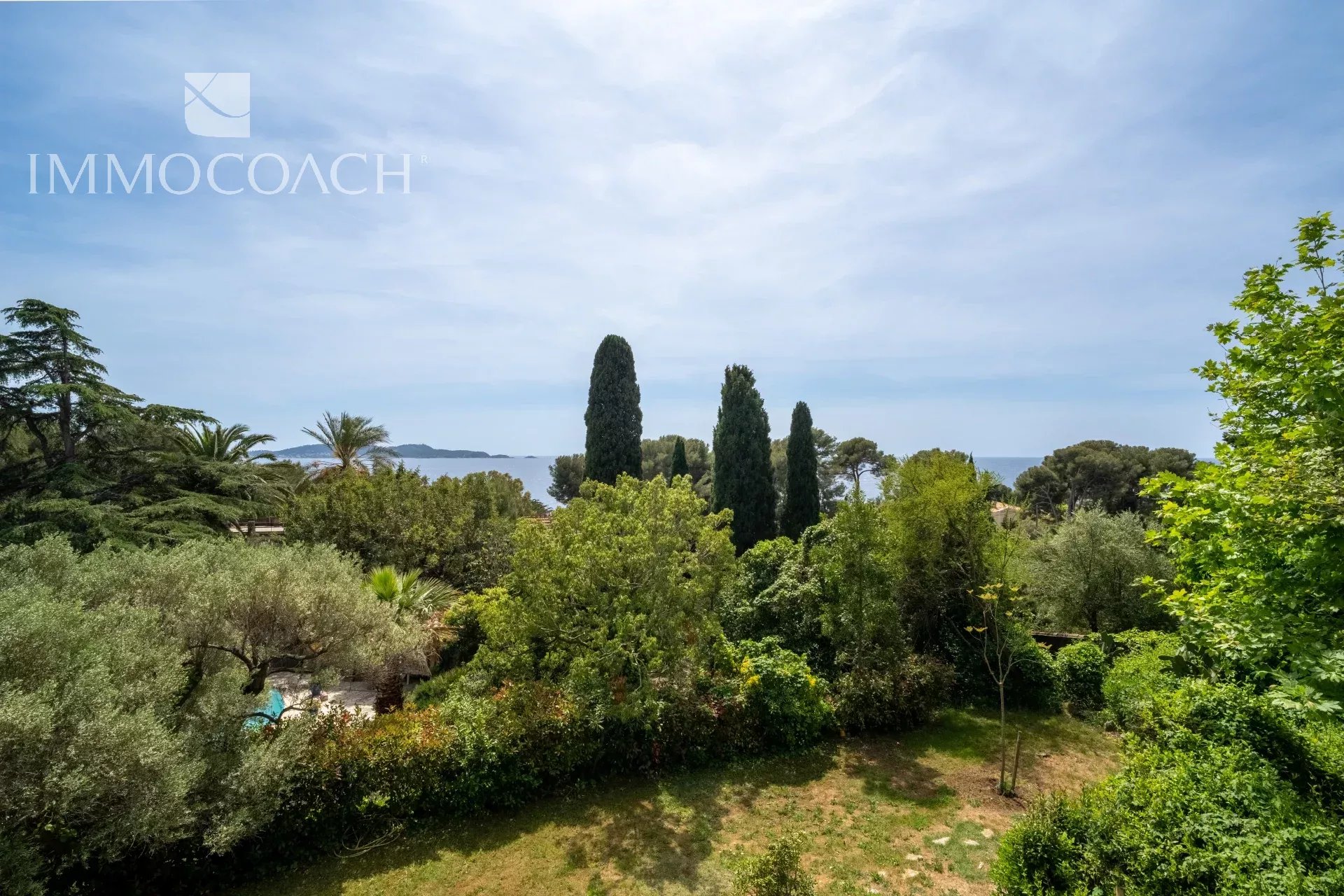 Sea view from a property surrounded by a landscaped park in Carqueiranne.