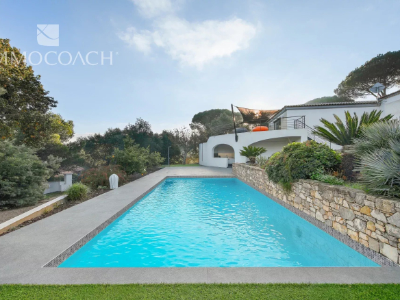 Modern swimming pool with terrace and garden in a property in Bormes-les-Mimosas.