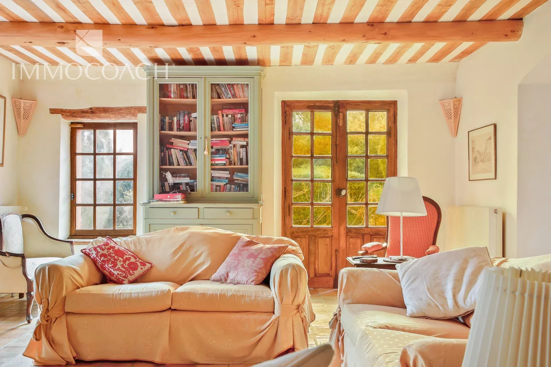 Interior of a country house in Collobrières Interior of a bastide with a bright living room and comfortable furniture.