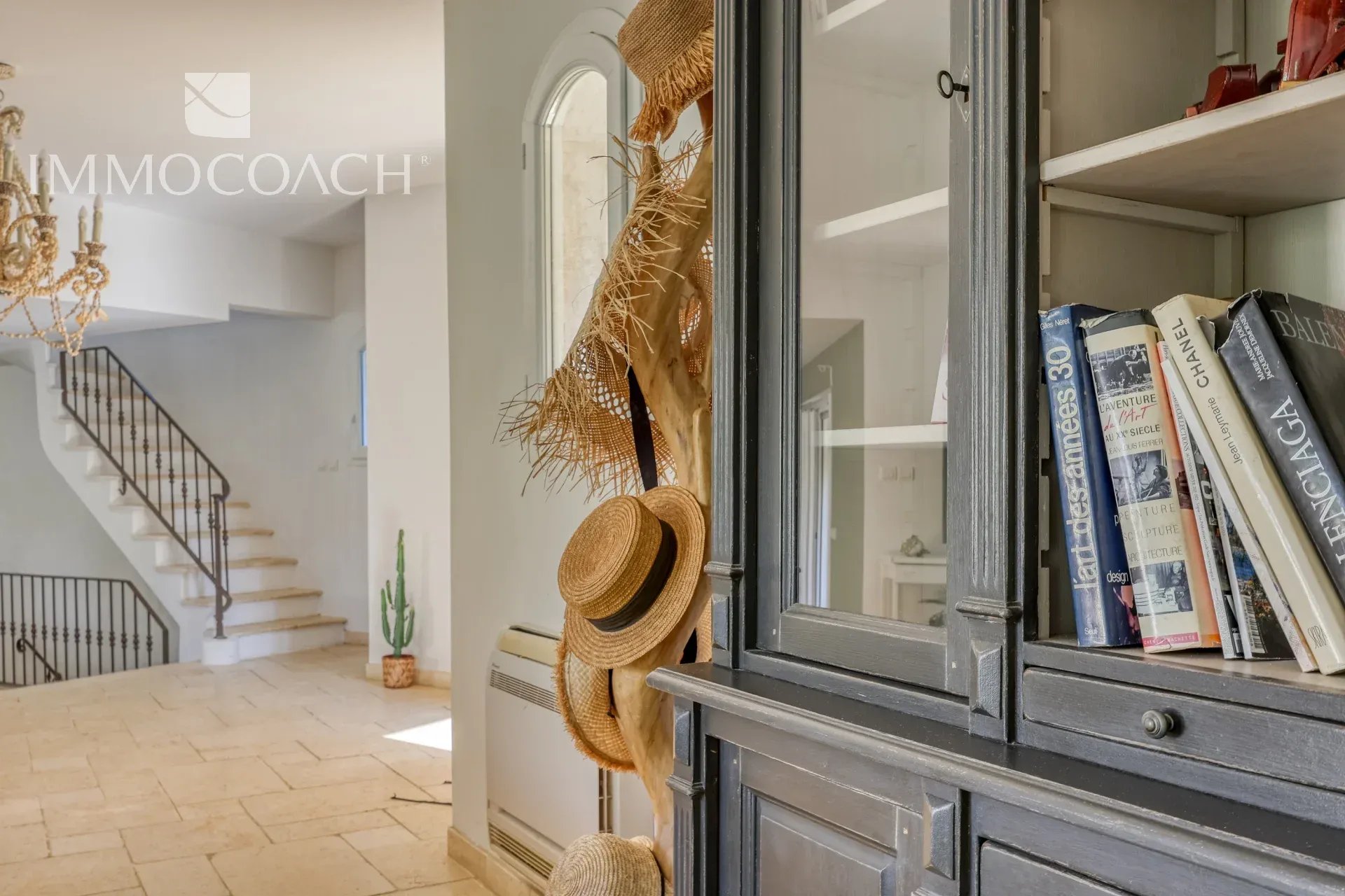 Interior of a villa in Bormes-les-Mimosas Interior of a neo-Provençal villa with elegant decoration and hats hanging on the walls.