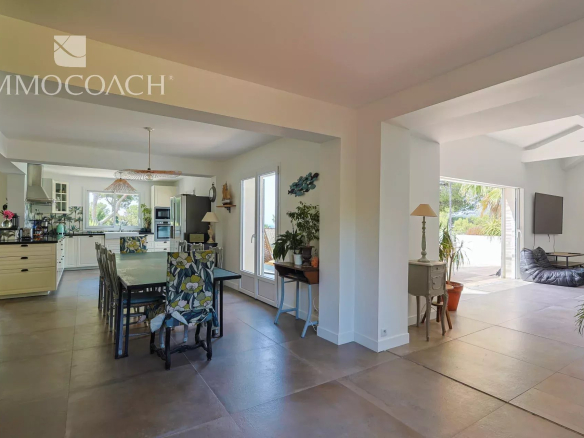Interior of a renovated house with open kitchen and dining room, Carqueiranne.