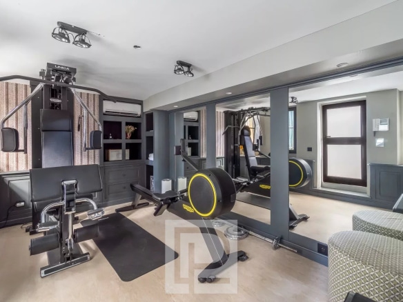Modern gym with fitness equipment in an artist's house in Cannes.