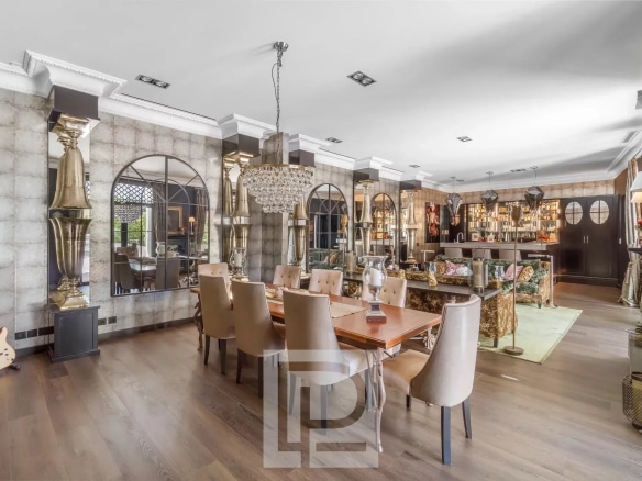 Interior of an artist's house in Cannes with chic baroque decor, dining room and living room.