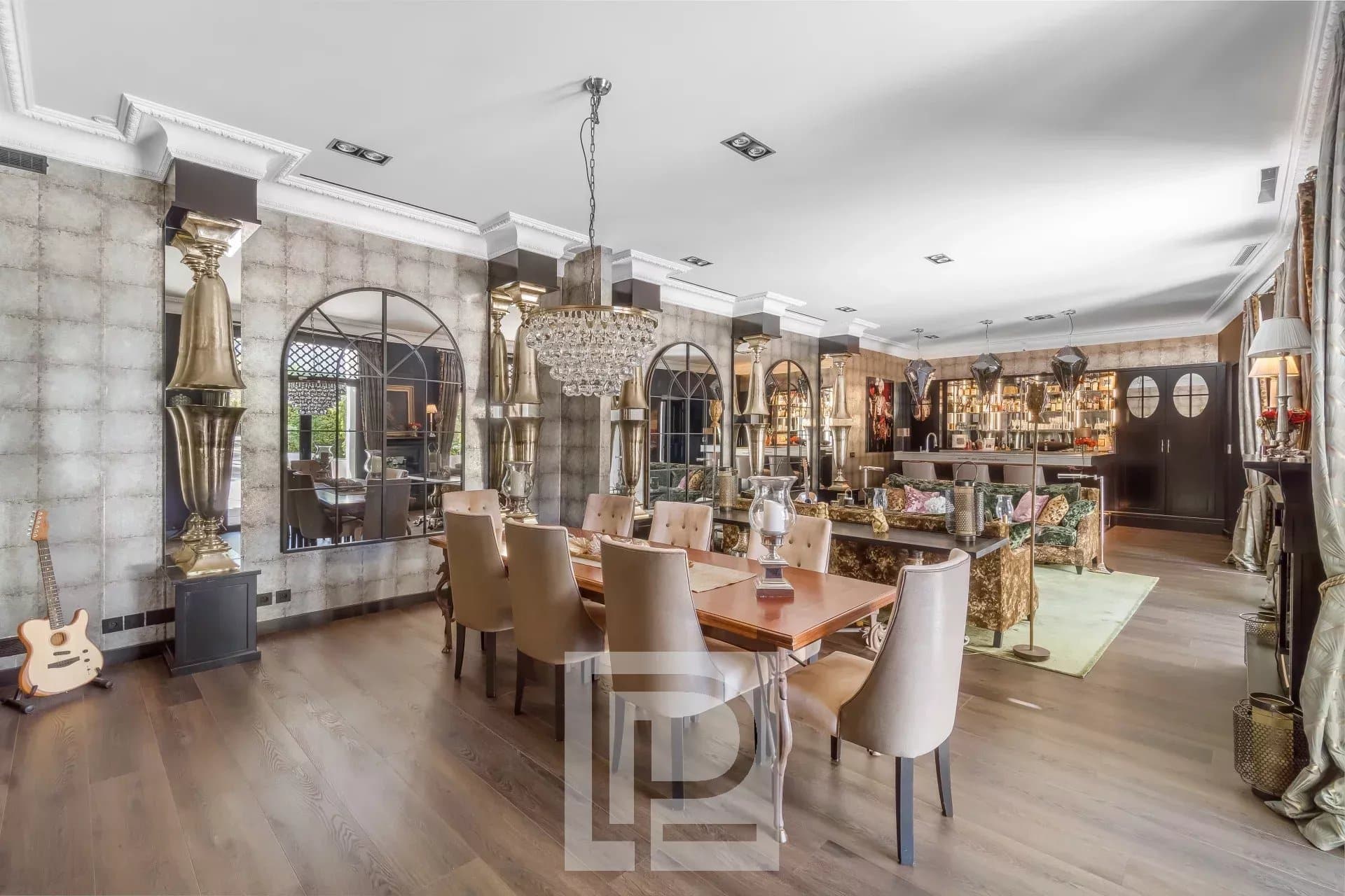 Interior of an artist's house in Cannes with chic baroque decor, dining room and living room.