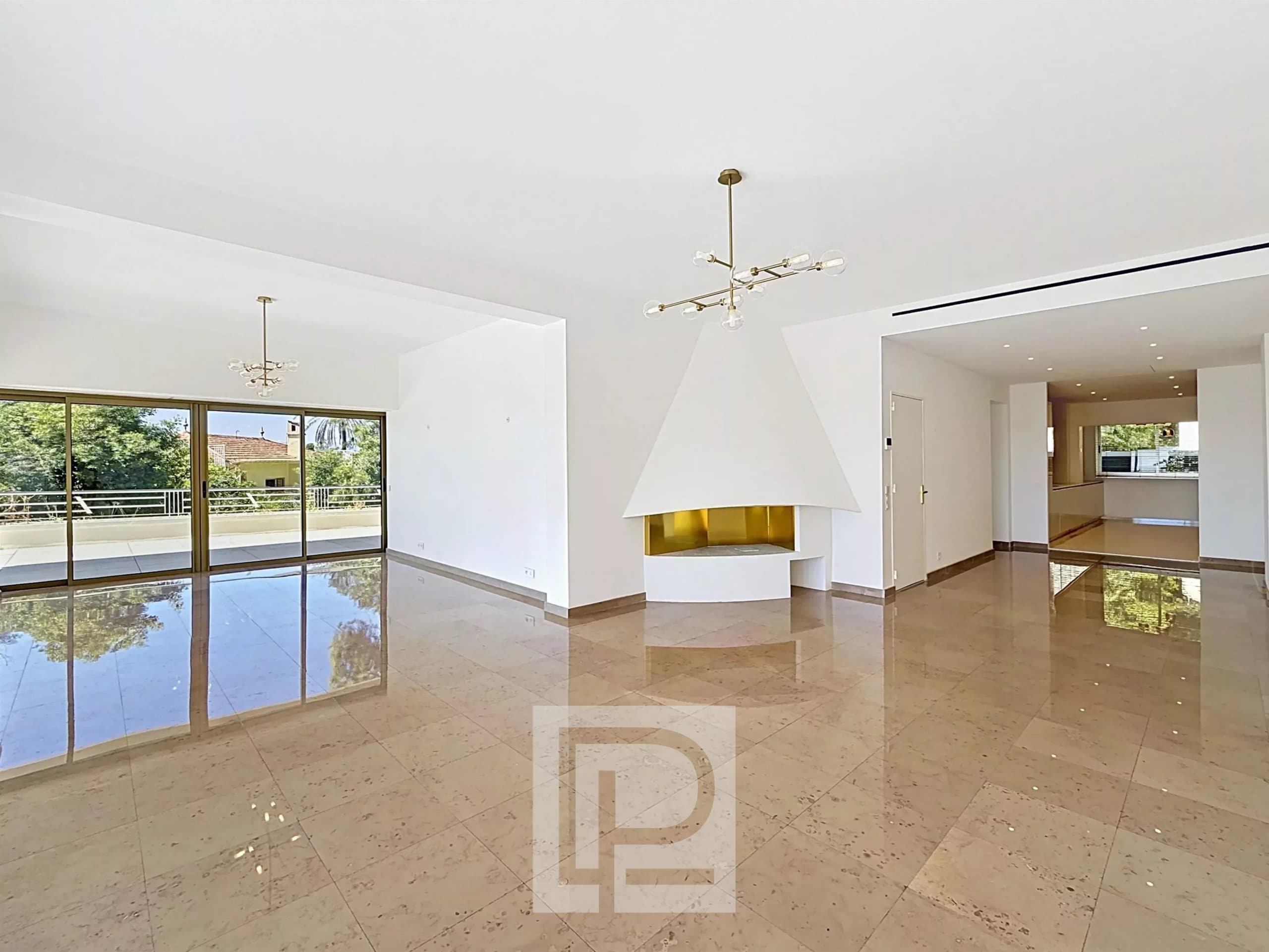 Interior of a bright apartment with bay windows, spacious living room and fireplace.