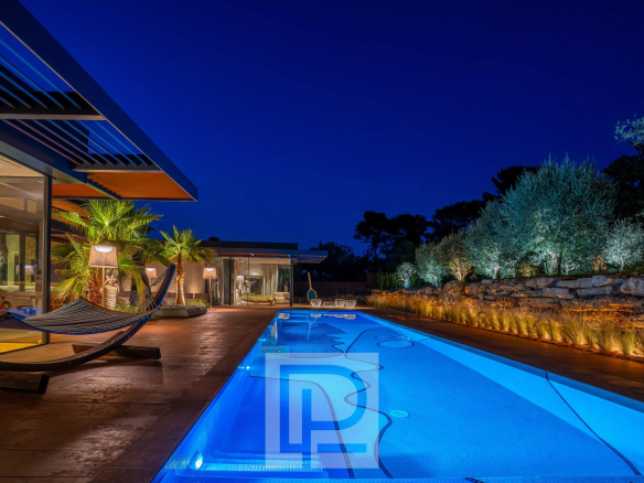 Contemporary villa with illuminated swimming pool in a private estate in Mougins.