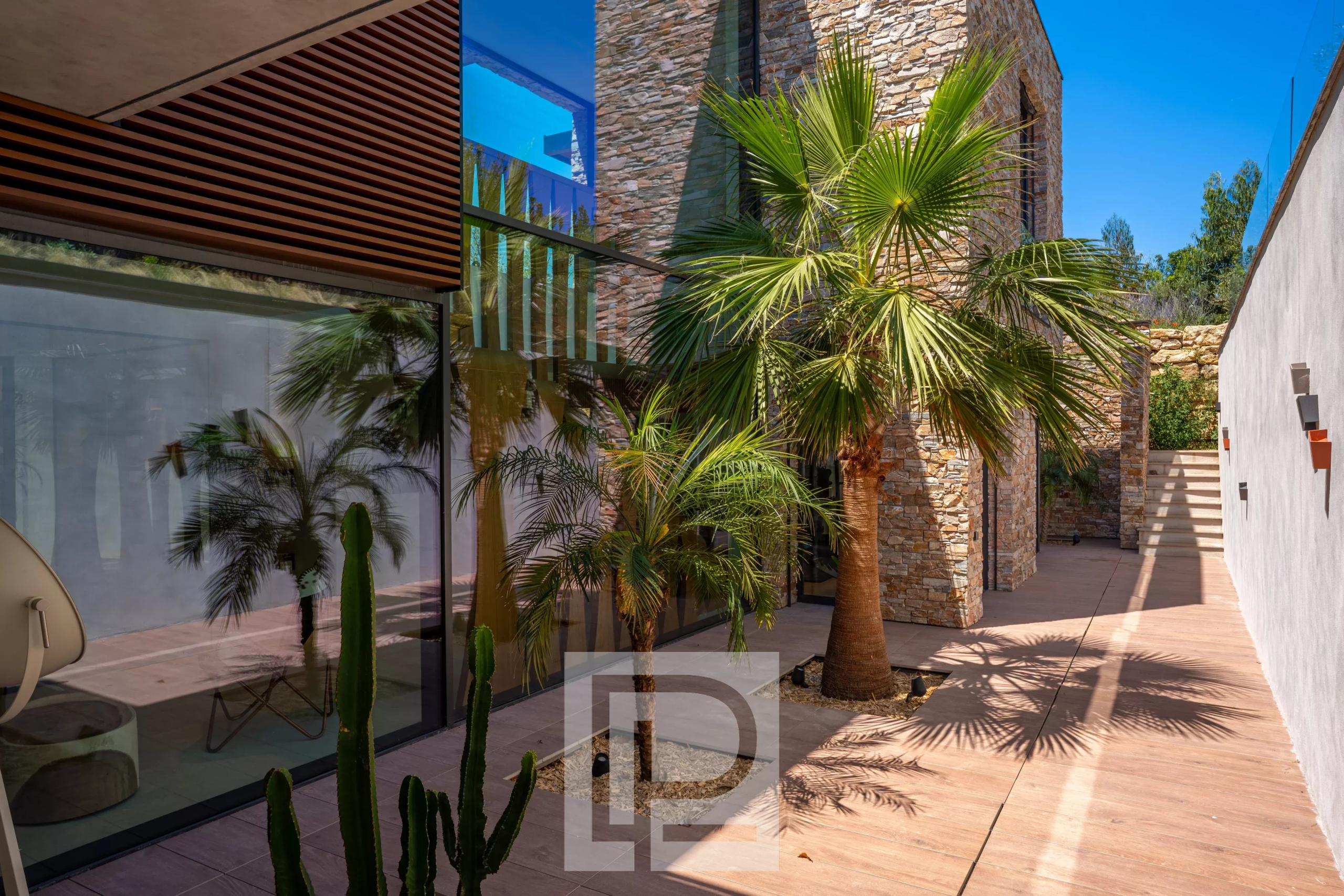 Contemporary property in Mougins Contemporary villa with garden and palm trees in Mougins