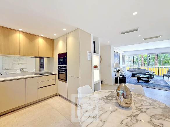 Interior of a renovated apartment in Cannes with a modern kitchen and bright living room