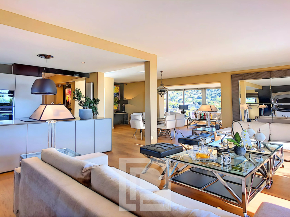 Interior of a modern apartment with spacious living room and open kitchen, Le Cannet.