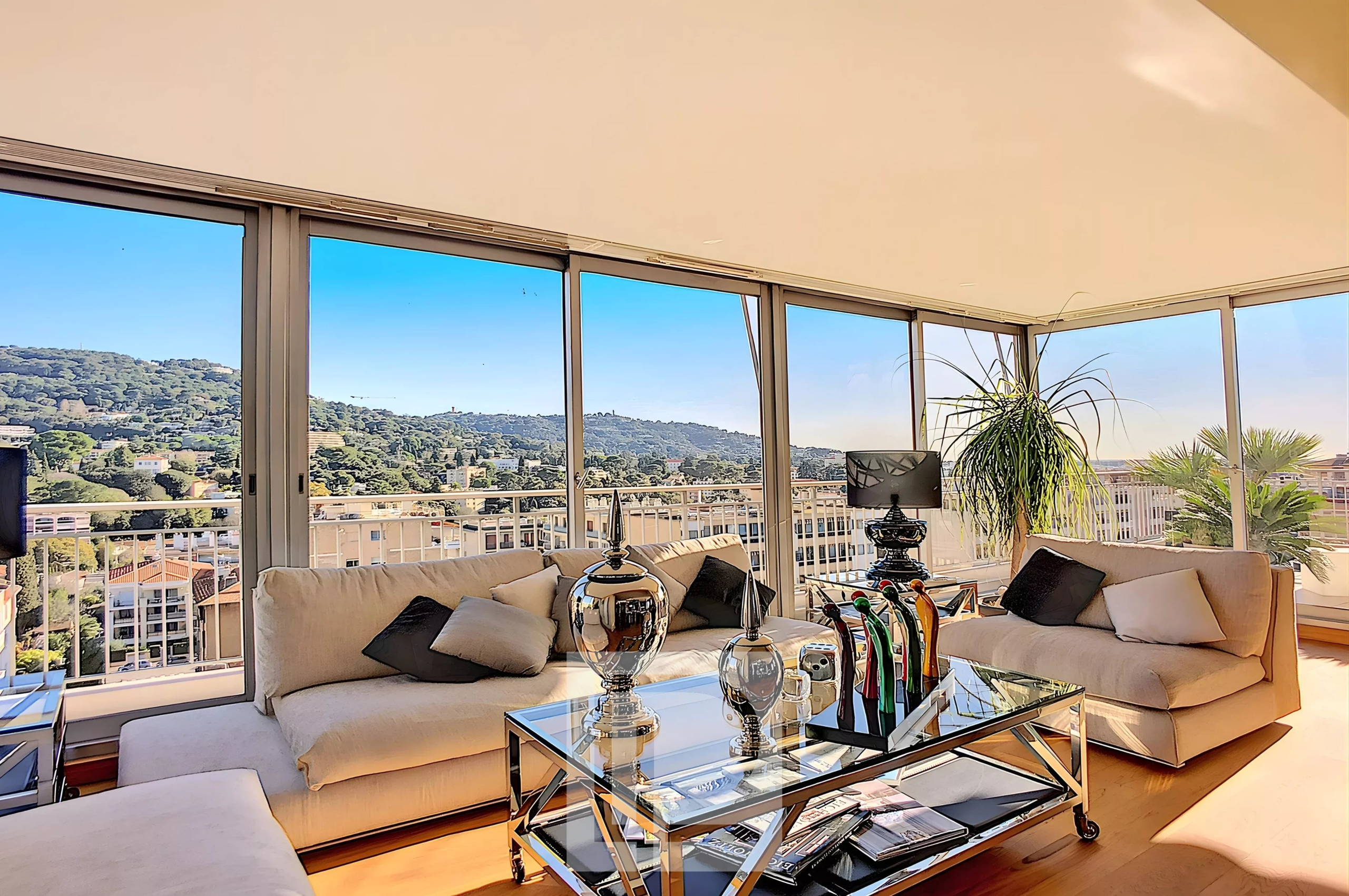 Bright apartment in Le Cannet Interior of a bright apartment with views of the hills, modern furniture and comfortable living space.