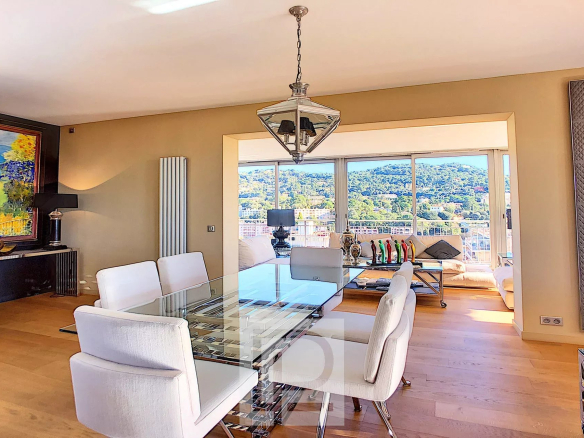 Modern dining room with panoramic views of the hills from an apartment in Le Cannet.