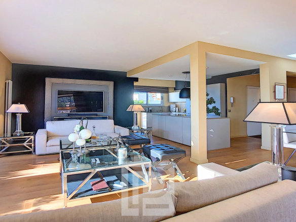 Spacious living room of a modern apartment with open-plan kitchen, Le Cannet