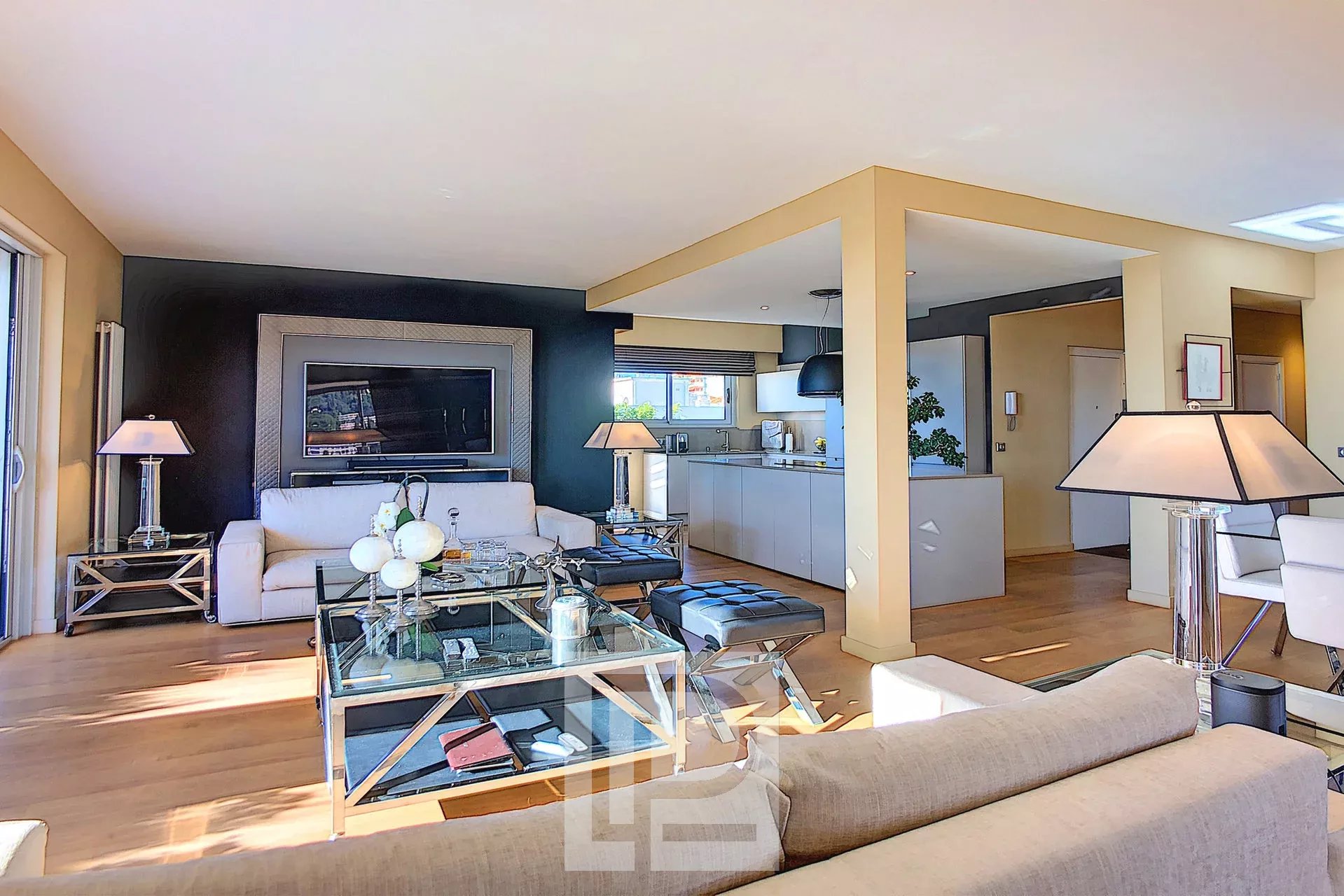 Modern living room in Le Cannet Spacious living room of a modern apartment with open-plan kitchen, Le Cannet