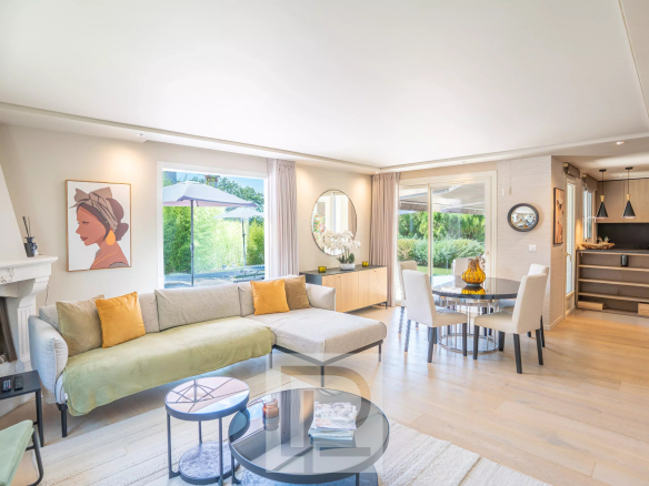 Interior of a renovated Provençal villa with a bright living room and modern furniture.