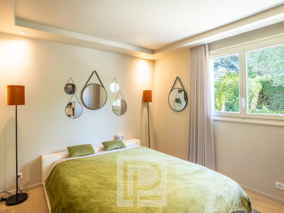 Room in a renovated Provençal villa with modern decor and garden view.