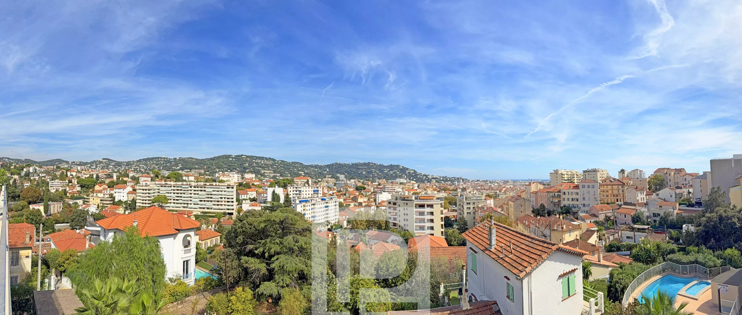 Panoramic view of Cannes Panoramic view of Cannes with buildings and hills in the background.