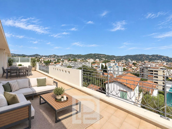 Apartment terrace with views of Cannes and the surrounding hills.