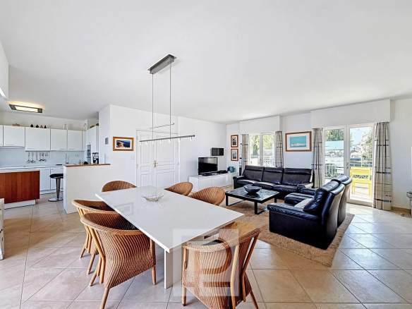 Interior of a modern apartment with living room and open kitchen in Cannes.