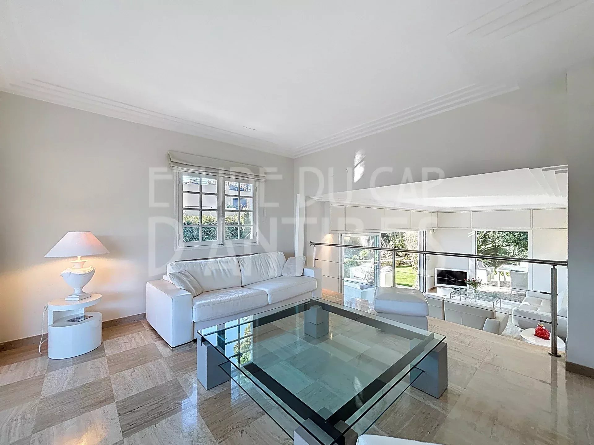 Living room of the villa near the beach in Antibes Interior of a villa in Antibes with a bright living room and modern furniture.