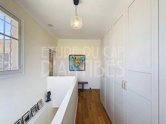 Interior of a house in Antibes with a bright hallway and built-in closets.