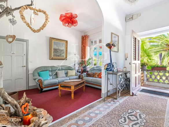 Interior of a property in Cannes with living room and access to a garden.
