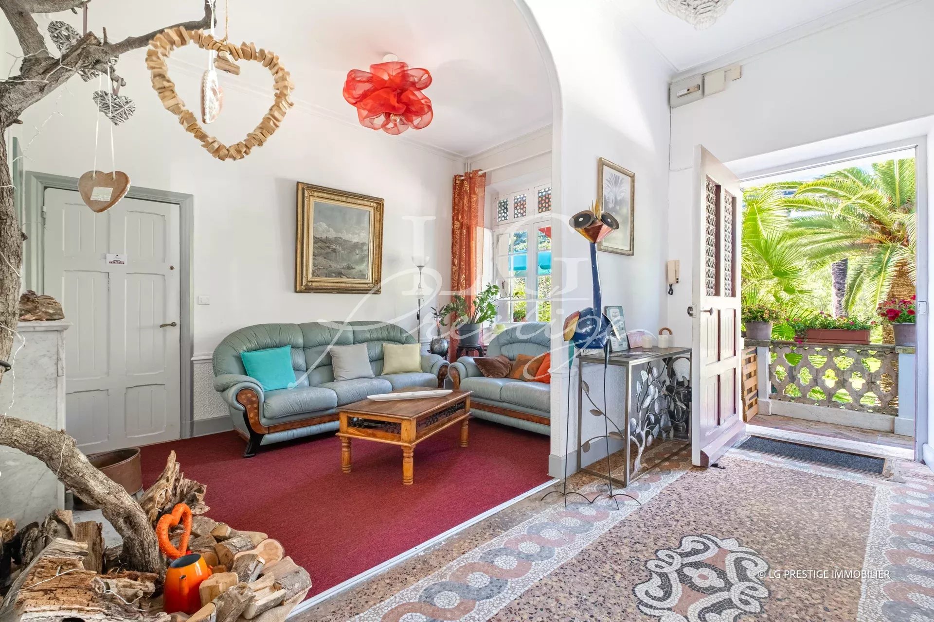 Interior of a property in Cannes with living room and access to a garden.