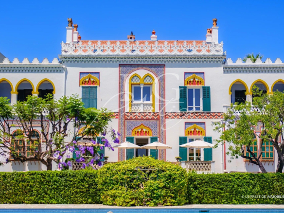 Historic seafront property in Cannes, three buildings with wooded grounds.
