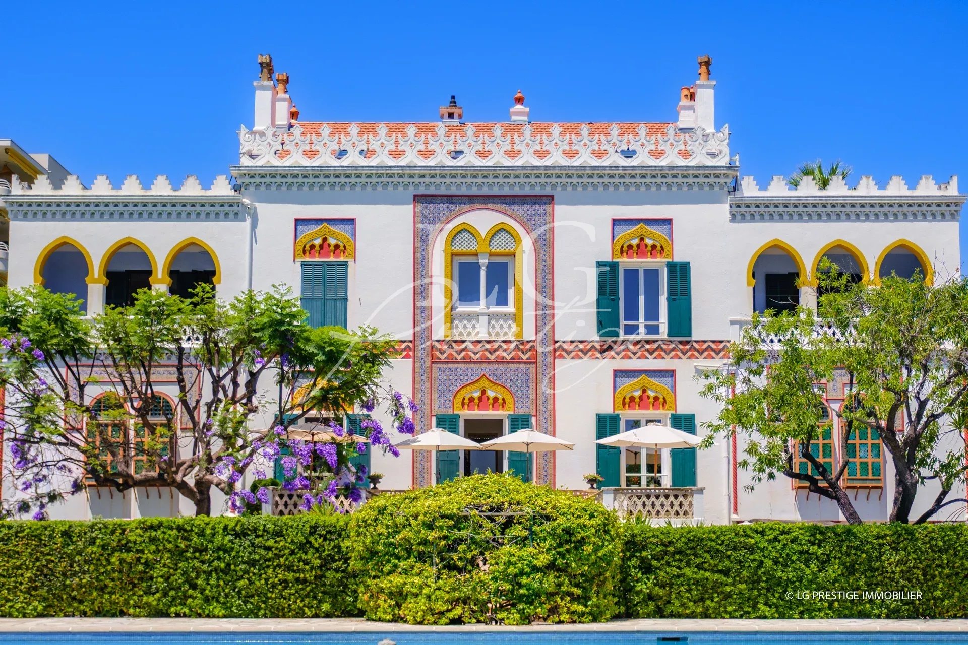 Historic seafront property in Cannes, three buildings with wooded grounds.