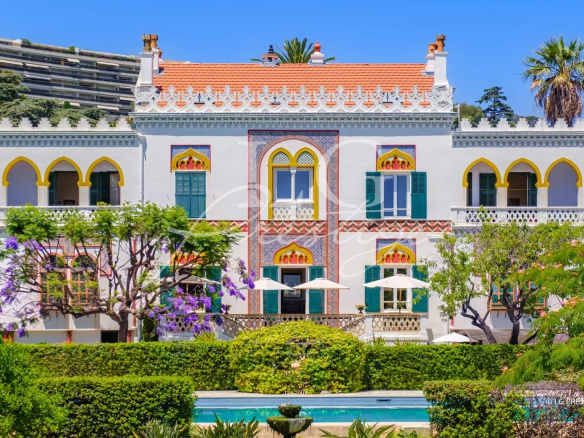 Exceptional historic-style property on the seafront in Cannes, with wooded park and old buildings.