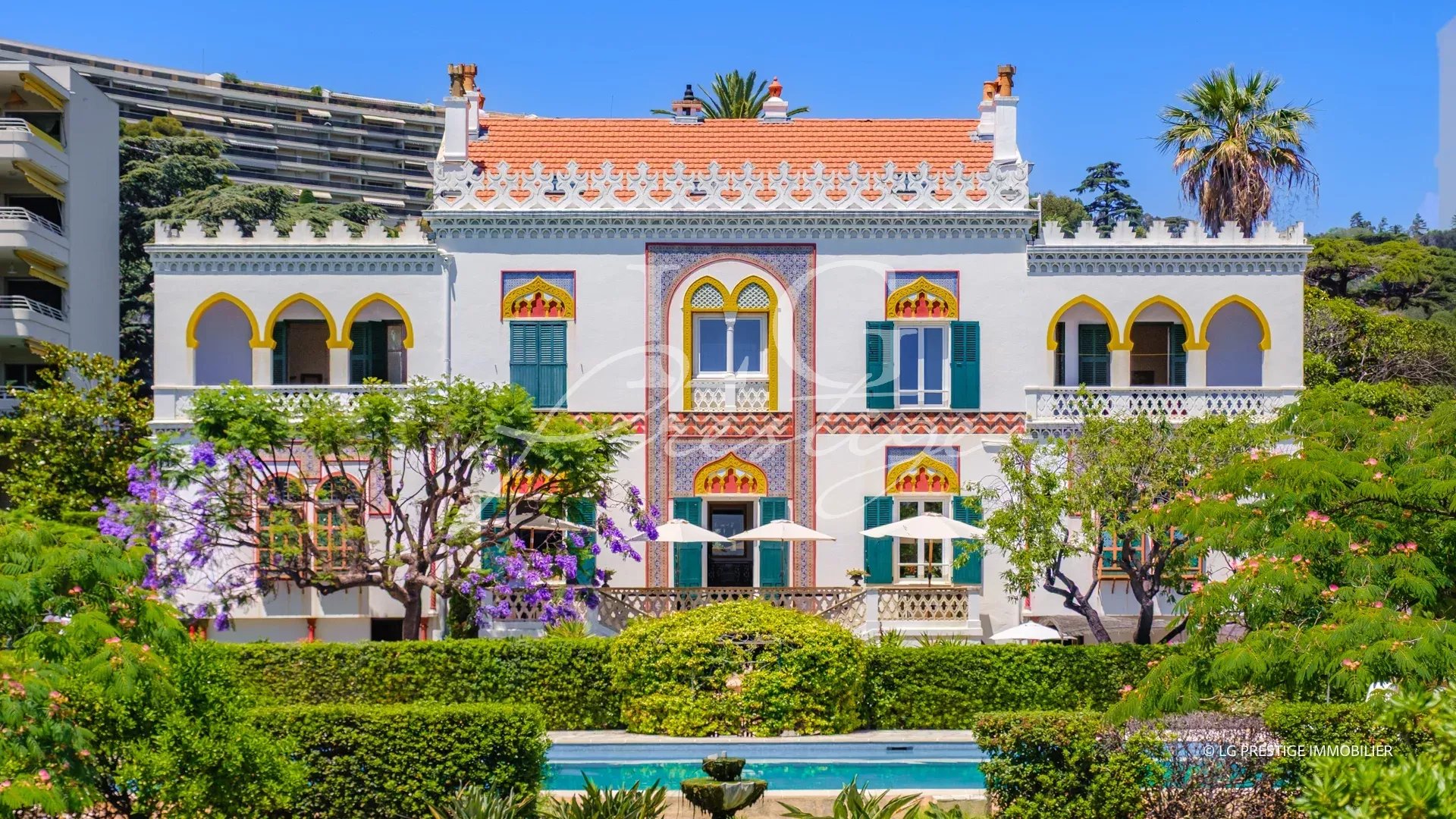 Exceptional historic-style property on the seafront in Cannes, with wooded park and old buildings.