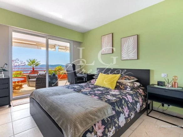 Apartment room with sea view in Mandelieu-la-Napoule, modern decor and terrace.